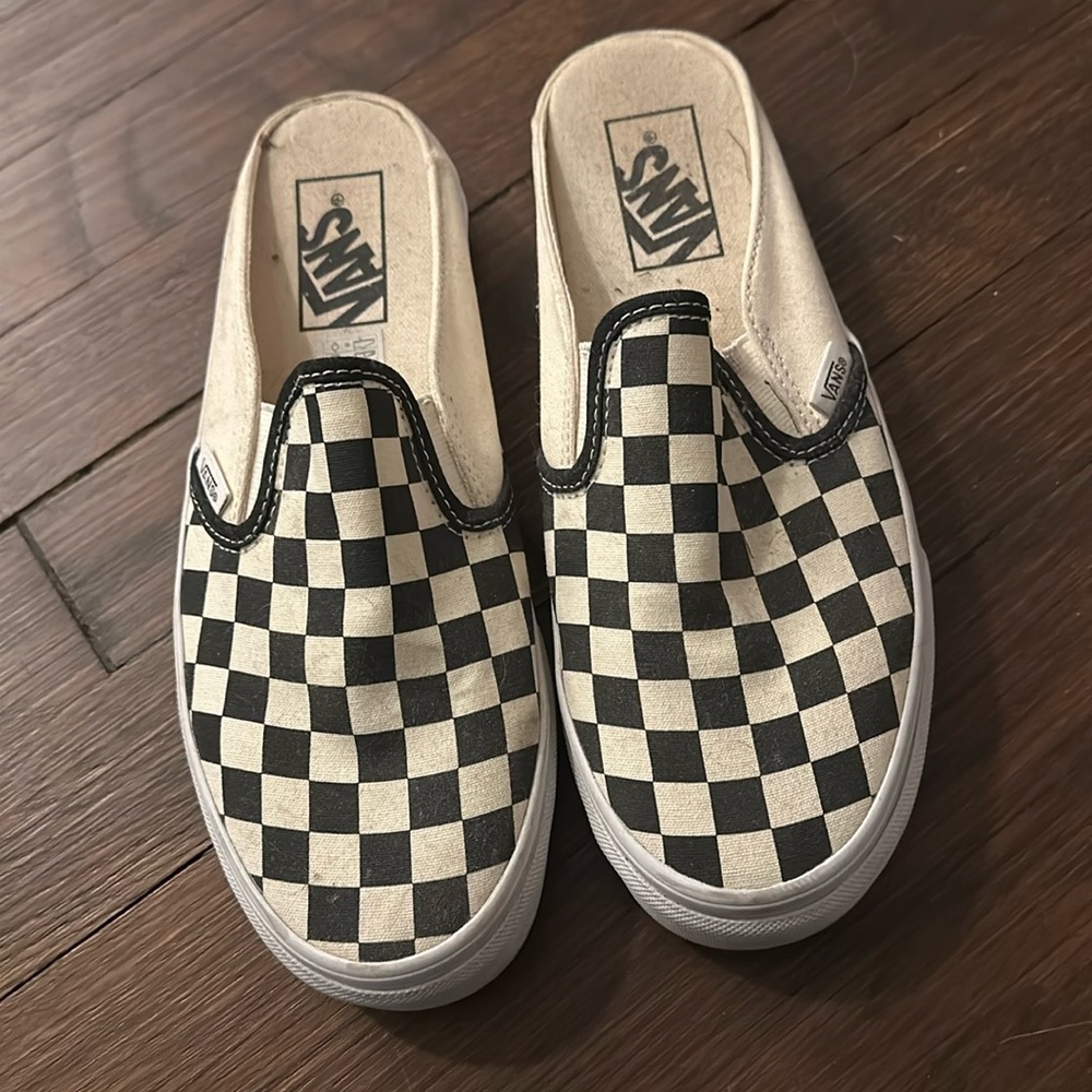 Black and white checkered Vans slip on sneakers with no heel, size 7 in women’s